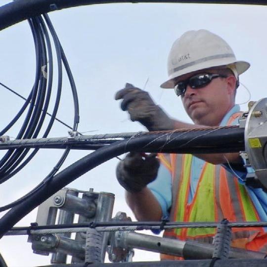 AT&T worker on pole